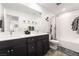 Well-lit bathroom offers double sinks, stylish decor, and tub/shower combo for convenience and comfort at 6141 May River St, Las Vegas, NV 89148