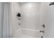 Clean white bathroom featuring a shower and bathtub combo with tile surround at 6141 May River St, Las Vegas, NV 89148