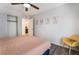 Relaxing bedroom with wood-look flooring, closet, and stylish artwork makes a comfortable retreat at 6141 May River St, Las Vegas, NV 89148