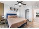 Cozy bedroom with wood-look floors, closet, and entry to the hall offers a relaxing atmosphere at 6141 May River St, Las Vegas, NV 89148