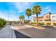 Gated entrance to the Evolve community, lined with palm trees and well-maintained landscaping at 6141 May River St, Las Vegas, NV 89148