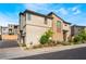Modern home with an attached garage, low-maintenance landscaping, and a paved driveway at 6141 May River St, Las Vegas, NV 89148