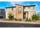 Attractive two-story home featuring modern architecture, desert landscaping, and a welcoming entryway at 6141 May River St, Las Vegas, NV 89148