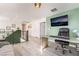 Upstairs loft office with a large screen tv, modern decor, and comfortable office chair at 6141 May River St, Las Vegas, NV 89148