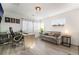 Bright home office featuring a modern desk, comfortable seating, and ample natural light at 6141 May River St, Las Vegas, NV 89148
