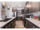 Modern kitchen features stainless steel appliances, stylish backsplash, and quartz countertops at 6141 May River St, Las Vegas, NV 89148