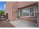 Backyard featuring gravel, small rock features and a concrete patio with glass paneled backdoor at 6599 Netherseal Ave, Las Vegas, NV 89139