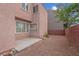 Backyard with gravel, small rock features and a concrete patio at 6599 Netherseal Ave, Las Vegas, NV 89139