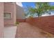 Backyard area featuring gravel and partial brick wall at 6599 Netherseal Ave, Las Vegas, NV 89139