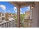 Balcony view of surrounding neighborhood, showcasing nearby homes and blue sky at 6599 Netherseal Ave, Las Vegas, NV 89139