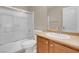 Bright bathroom with a shower-tub combo and a single sink vanity at 6599 Netherseal Ave, Las Vegas, NV 89139