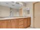 Bathroom with double vanity, modern fixtures, and an oversized mirror for added light at 6599 Netherseal Ave, Las Vegas, NV 89139