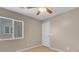 Bedroom featuring a ceiling fan, wood laminate floors, and a window providing natural light at 6599 Netherseal Ave, Las Vegas, NV 89139