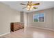Bright bedroom with ceiling fan, wood floors, neutral walls, and plenty of natural light at 6599 Netherseal Ave, Las Vegas, NV 89139