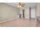 Bedroom features wood floors, ceiling fan, closet, and neutral-colored walls at 6599 Netherseal Ave, Las Vegas, NV 89139