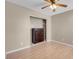 Well lit bedroom featuring a closet area, neutral paint color and light colored wood flooring at 6599 Netherseal Ave, Las Vegas, NV 89139