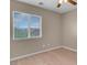 Bedroom featuring a ceiling fan, window with blinds and light laminate flooring at 6599 Netherseal Ave, Las Vegas, NV 89139