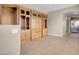 Dining Room with ample shelving and cabinetry next to kitchen with stainless refrigerator at 6599 Netherseal Ave, Las Vegas, NV 89139