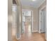 Bright hallway features wood floors and multiple entryways to other rooms at 6599 Netherseal Ave, Las Vegas, NV 89139