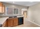The kitchen showcasing ample counter space, cabinetry, and modern black dishwasher at 6599 Netherseal Ave, Las Vegas, NV 89139