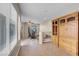 Spacious living area with exercise equipment, tiled floors and natural light at 6599 Netherseal Ave, Las Vegas, NV 89139