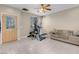 Spacious living area featuring neutral tones, tile flooring and natural light at 6599 Netherseal Ave, Las Vegas, NV 89139