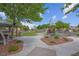 Community playground features a gazebo with picnic tables and mature trees at 6599 Netherseal Ave, Las Vegas, NV 89139