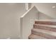 Carpeted stairway featuring neutral walls and staircase to the upper level at 6599 Netherseal Ave, Las Vegas, NV 89139
