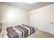 Neutral bedroom featuring carpet, closet, and a bed, bathed in a soothing light at 6623 Hurkling Stone Ave, Las Vegas, NV 89139