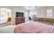 Spacious bedroom with a TV and desk setup at 6623 Hurkling Stone Ave, Las Vegas, NV 89139