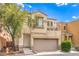 Inviting two-story home featuring a balcony, stucco exterior, and well-maintained landscaping at 6623 Hurkling Stone Ave, Las Vegas, NV 89139