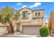 Inviting two-story home featuring a balcony, stucco exterior, and well-maintained landscaping at 6623 Hurkling Stone Ave, Las Vegas, NV 89139