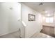 Hallway with tile and wood flooring and view of the staircase at 6623 Hurkling Stone Ave, Las Vegas, NV 89139