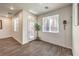 Versatile living area with wood-style floors, recessed lighting, and access to the backyard at 6623 Hurkling Stone Ave, Las Vegas, NV 89139