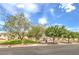 Beautiful street view with lush trees, green spaces, and well-maintained landscaping at 6623 Hurkling Stone Ave, Las Vegas, NV 89139
