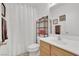 Cozy bathroom with shower, vanity, and decorative shelving with neutral walls at 6705 Frances Celia Ave, Las Vegas, NV 89122