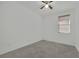 This bedroom features neutral walls, carpet flooring and a ceiling fan at 6705 Frances Celia Ave, Las Vegas, NV 89122