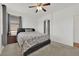Bedroom features carpeted floors, a ceiling fan, and windows for natural light at 6705 Frances Celia Ave, Las Vegas, NV 89122