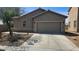 Attractive single-story home with a two-car garage, neutral exterior paint, and tidy front yard landscaping at 6705 Frances Celia Ave, Las Vegas, NV 89122