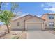 Well-maintained home featuring a two-car garage and desert-friendly front yard landscaping at 6705 Frances Celia Ave, Las Vegas, NV 89122