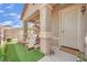 Inviting front porch with seating, a decorative door, and welcoming decor for a cozy entrance at 6705 Frances Celia Ave, Las Vegas, NV 89122