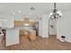 Bright kitchen features wood cabinets, stainless steel appliances, and breakfast bar seating at 6705 Frances Celia Ave, Las Vegas, NV 89122