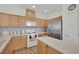 Bright kitchen features wood cabinets, stainless steel appliances, and center island at 6705 Frances Celia Ave, Las Vegas, NV 89122