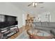 Inviting living space with hardwood floors, a comfortable sofa, and an open kitchen view at 6705 Frances Celia Ave, Las Vegas, NV 89122