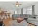 Cozy living area featuring hardwood floors, a sectional couch, and an open-concept layout at 6705 Frances Celia Ave, Las Vegas, NV 89122