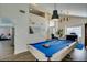 Spacious game room with a pool table and an open view of the living room and staircase at 6736 Quinella Dr, Las Vegas, NV 89103