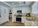Well-appointed kitchen with stainless steel appliances and beautiful granite countertops at 6736 Quinella Dr, Las Vegas, NV 89103