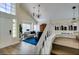 Bright and airy living room featuring high ceilings and a staircase leading to upper level at 6736 Quinella Dr, Las Vegas, NV 89103