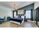 Serene main bedroom with a large window, accent wall, and elegant decor for a calming atmosphere at 6736 Quinella Dr, Las Vegas, NV 89103