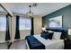 Stylish main bedroom showcasing modern lighting fixtures, neutral decor, and a sleek closet design at 6736 Quinella Dr, Las Vegas, NV 89103